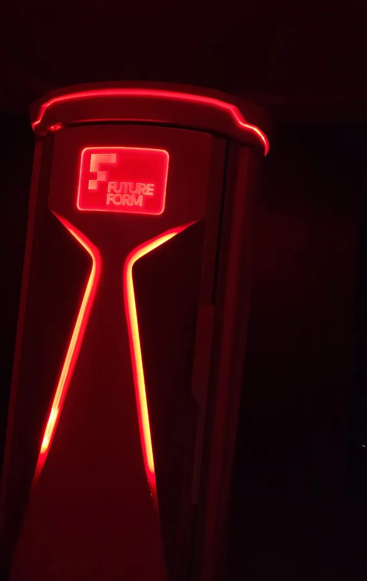 Therapy chamber running in a darkened room with the red light signature illuminated