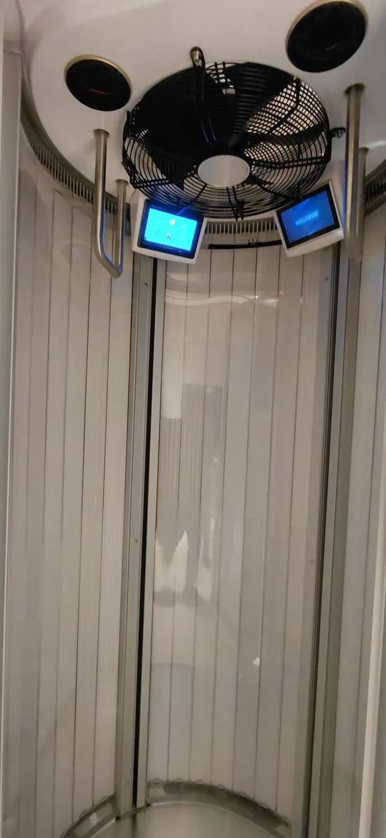 Close view of the chamber ceiling with twin touchscreen controllers and extract fan wired in